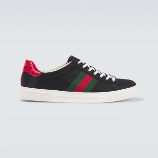 Modedesigner Gucci Turnschuhe mit Lederbesatz schwarz