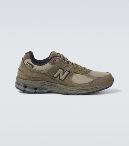 gefälschter Designer New Balance 2002R Turnschuhe mit Wildlederbesatz grün